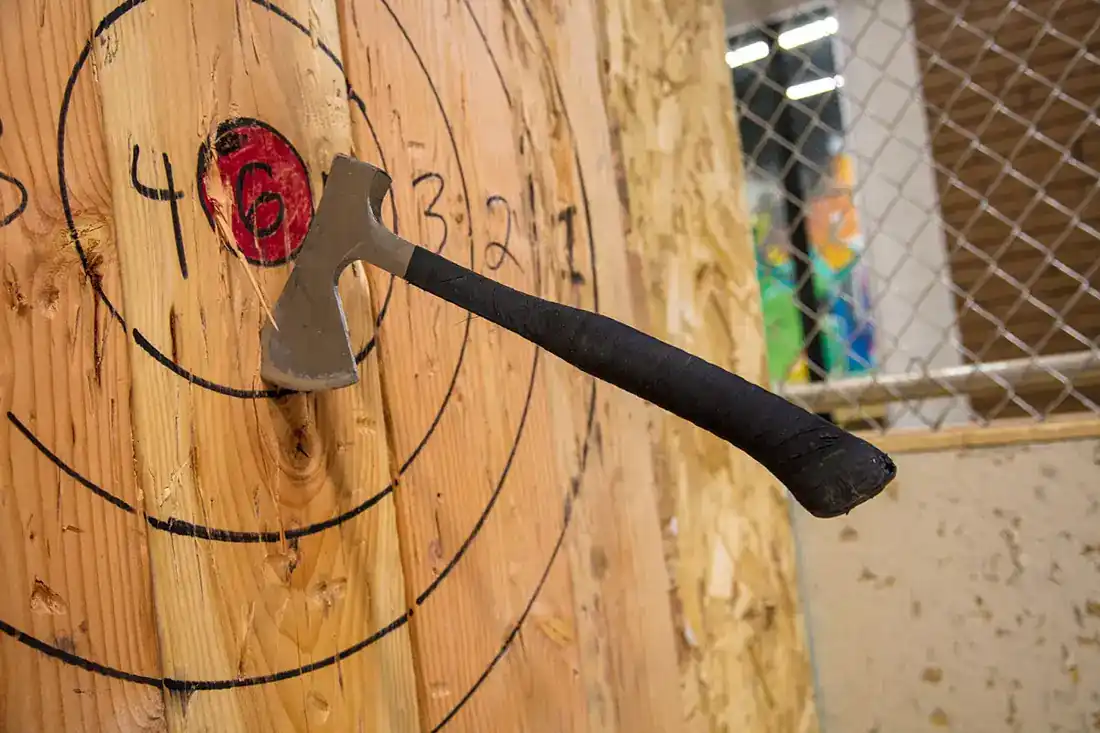 Axe stuck in a wooden target
