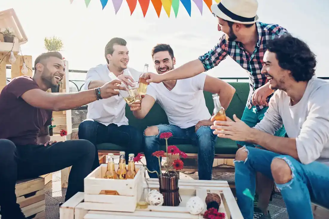 Friends toasting on a patio