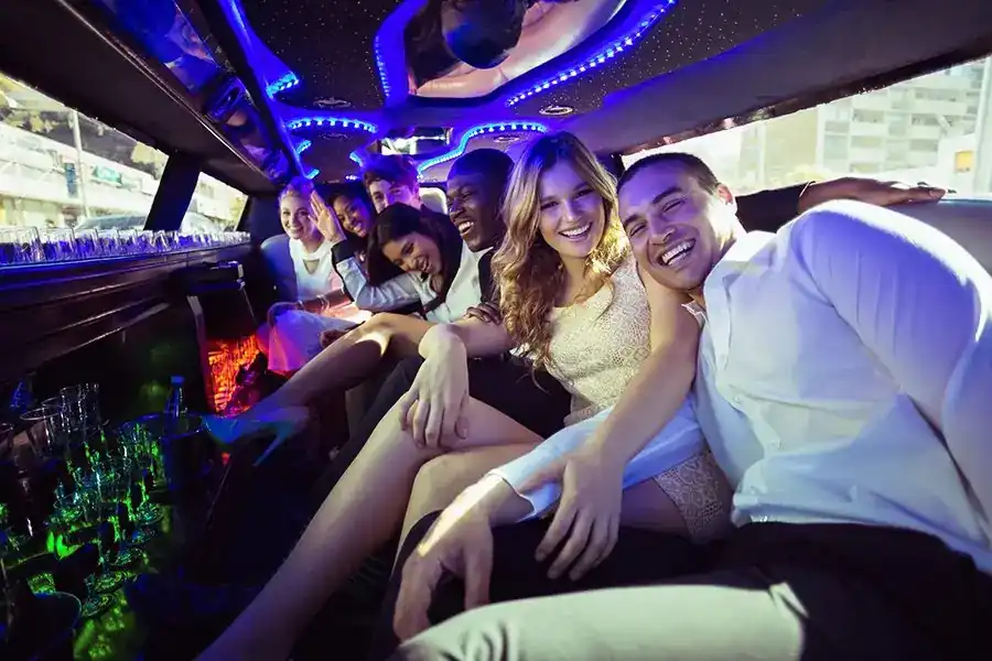 Friends celebrating in a party vehicle