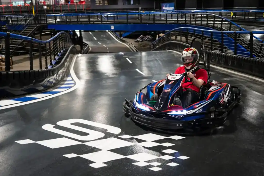 Go-kart racer on an indoor track