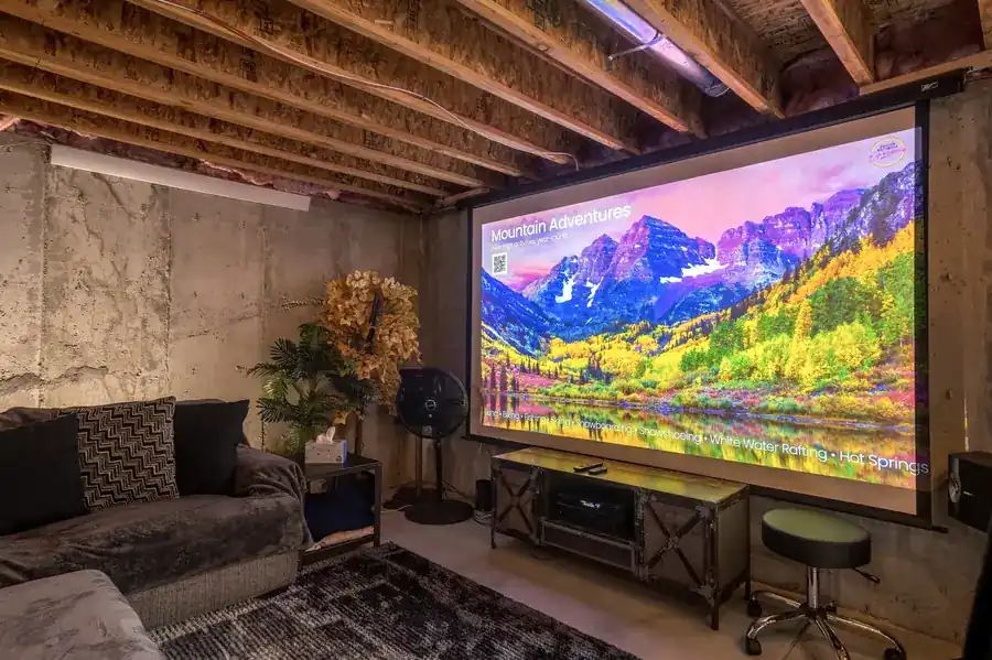 Theater room with a large screen at RiNo Party Palace